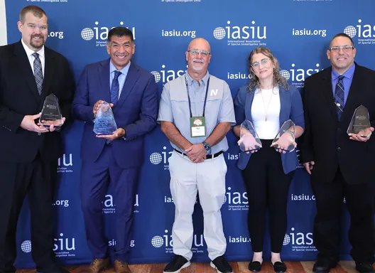 Members of the Iowa Insurance Division accept IASIU award